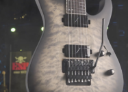 ESP LTD M-1007B 7-string baritone electric guitar in Charcoal Burst Satin with quilted top and Floyd Rose tremolo.