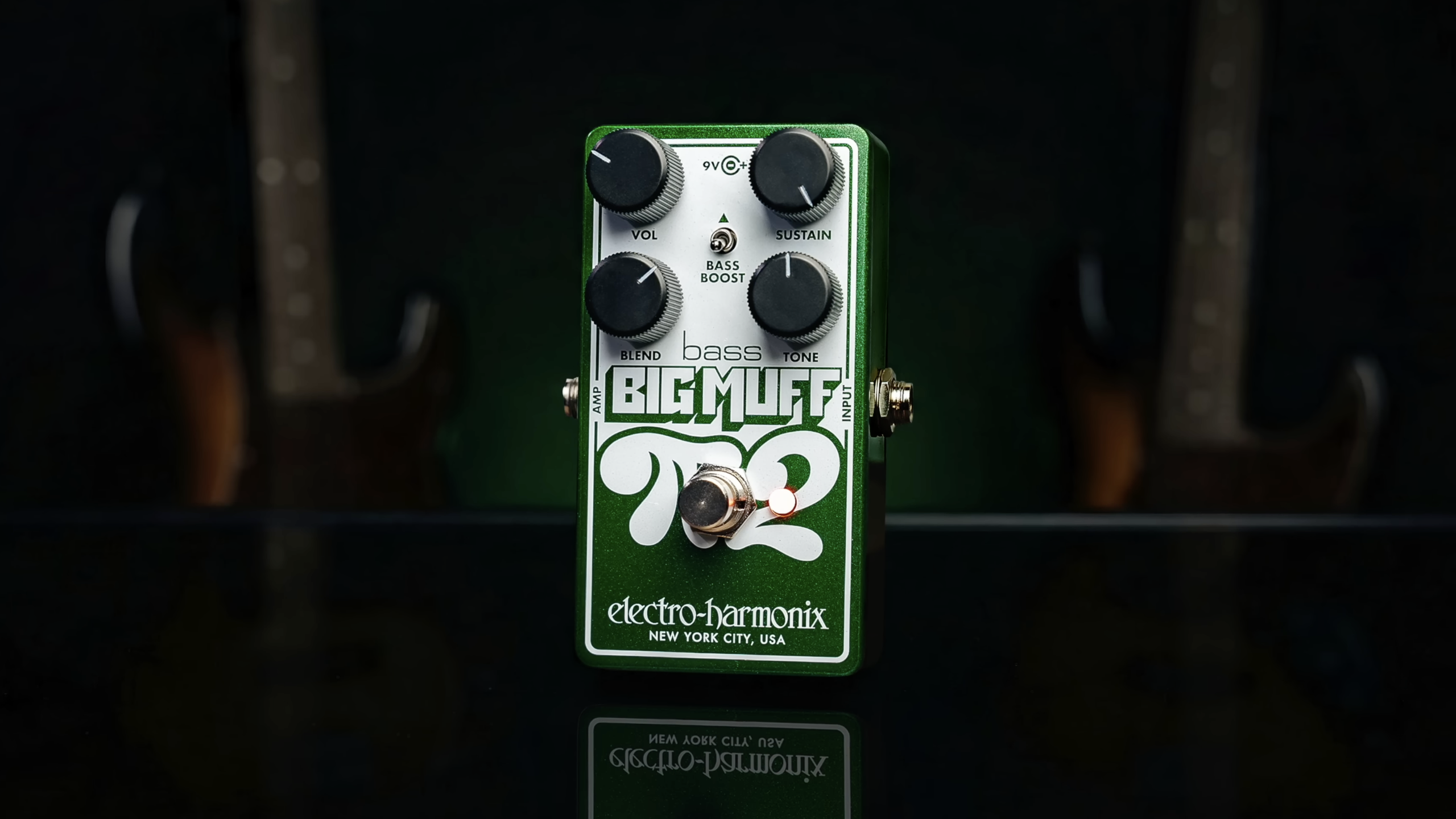 Electro-Harmonix Bass Big Muff Pi 2 fuzz pedal with green enclosure, four control knobs, and bass boost switch.