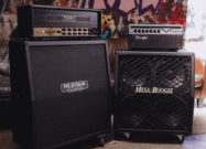Mesa/Boogie 90s Triple Rectifier amplifier head on top of a Mesa cabinet beside a Mesa/Boogie combo amp.