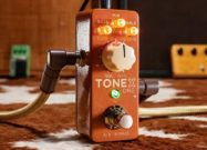 IK Multimedia TONEX ONE Double Special Limited Edition guitar pedal with vintage brown finish and illuminated control knobs.