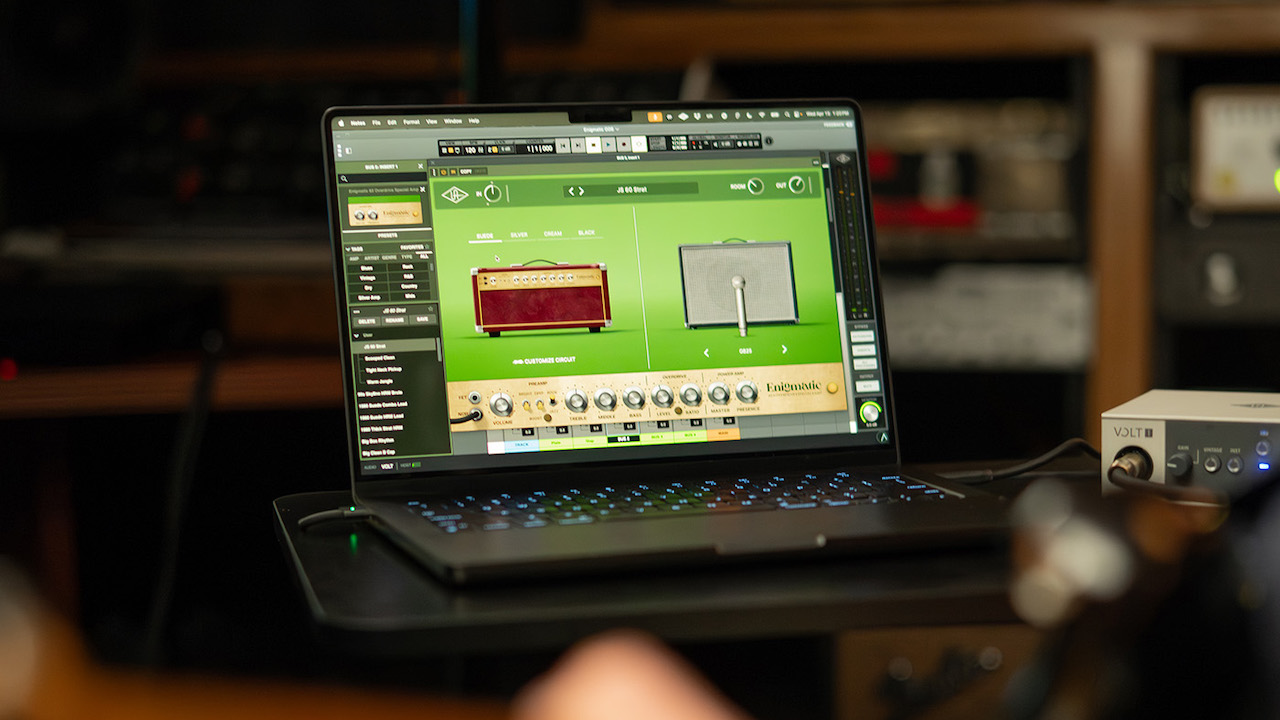 Universal Audio UAD Enigmatic '82 Overdrive Special amp simulator plugin interface in a DAW, featuring D-style boutique guitar amp modeling, Rock Jazz Custom voicings, and cabinet and microphone simulations.