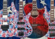 Four Ibanez 250th USA Anniversary electric guitars displayed side by side, each featuring an American flag-inspired red, white, and blue finish.