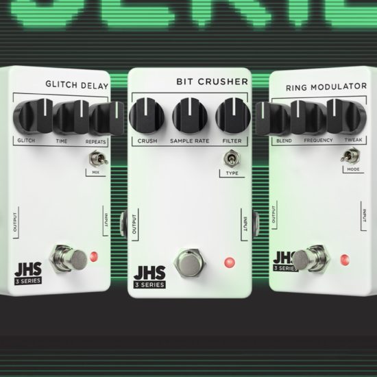 Three white JHS 3 Series guitar pedals — the Glitch Delay, Bit Crusher, and Ring Modulator — are displayed side by side against a retro green digital “ALERT!” background. Each pedal features minimalist black knobs, simple labeling, and a compact design, with a “$99 each” graphic shown on the left.