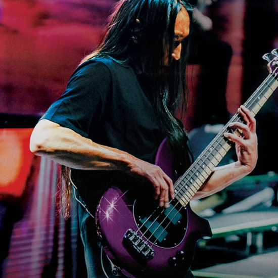A photo of John Myung playing the John Myung Bongo 4