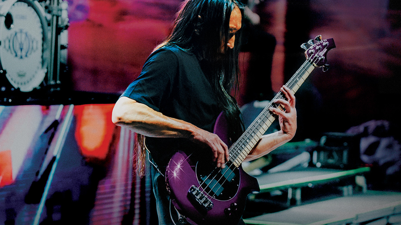 A photo of John Myung playing the John Myung Bongo 4