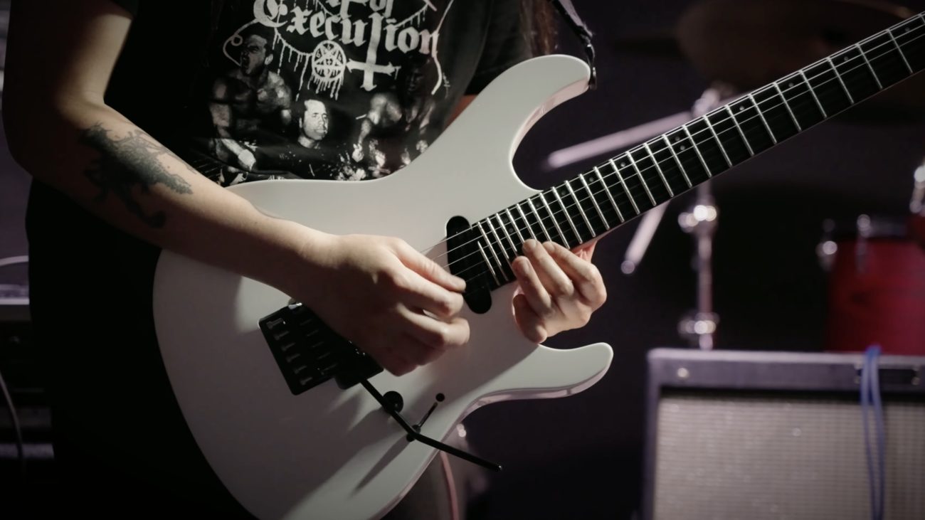 A photo of Jongha Jeong demoing the LTD Deluxe MV-1000