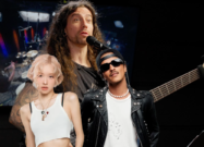 A photo of Archspire bassist Jared Smith behind Rosé and Bruno Mars
