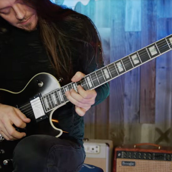 A photo of Doug Weiand playing the Epiphone Les Paul Prophecy in Aged Jet Black Metallic