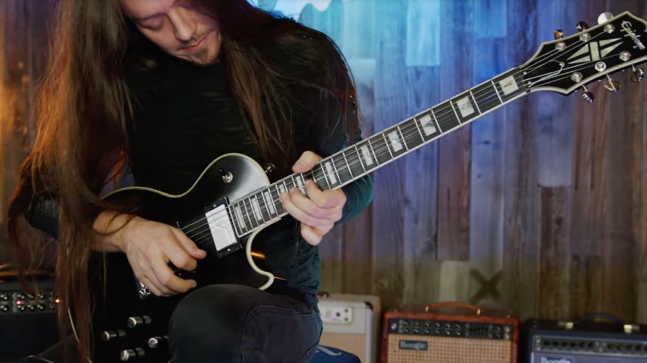 A photo of Doug Weiand playing the Epiphone Les Paul Prophecy in Aged Jet Black Metallic
