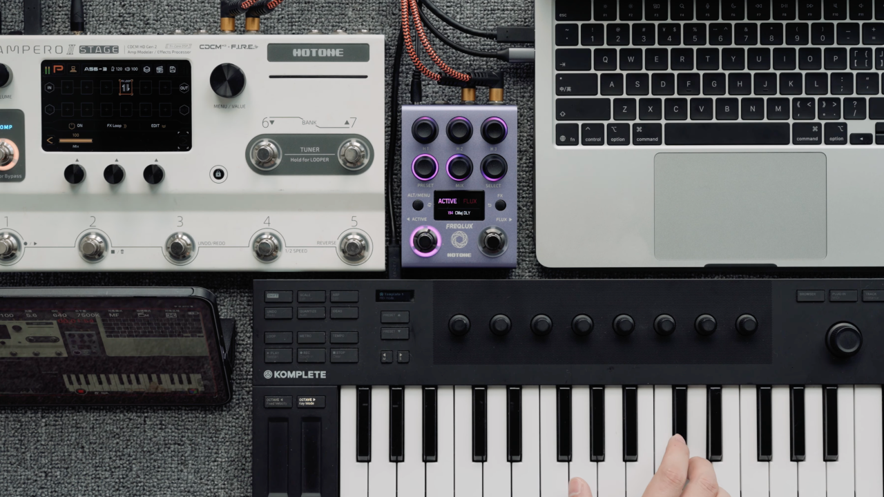 A photo of the Hotone Freqlux paired with a synthesizer