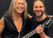 A photo of Kirk Hammett holding Gojira guitarist Christian Andreu's brand-new Pro Plus Series signature model
