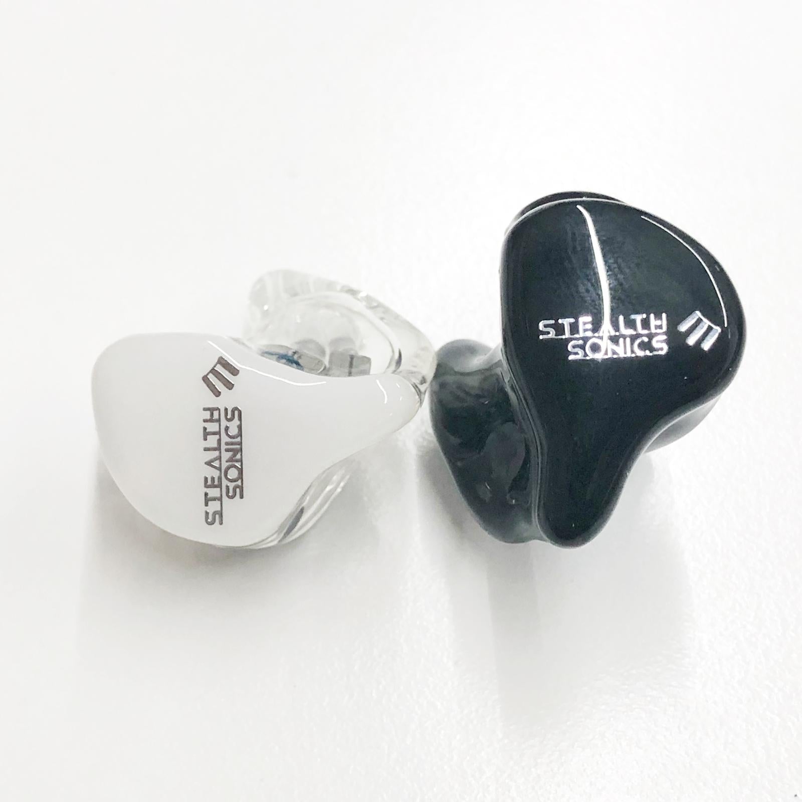 Stealth Sonics custom in-ear monitors in white and black shells