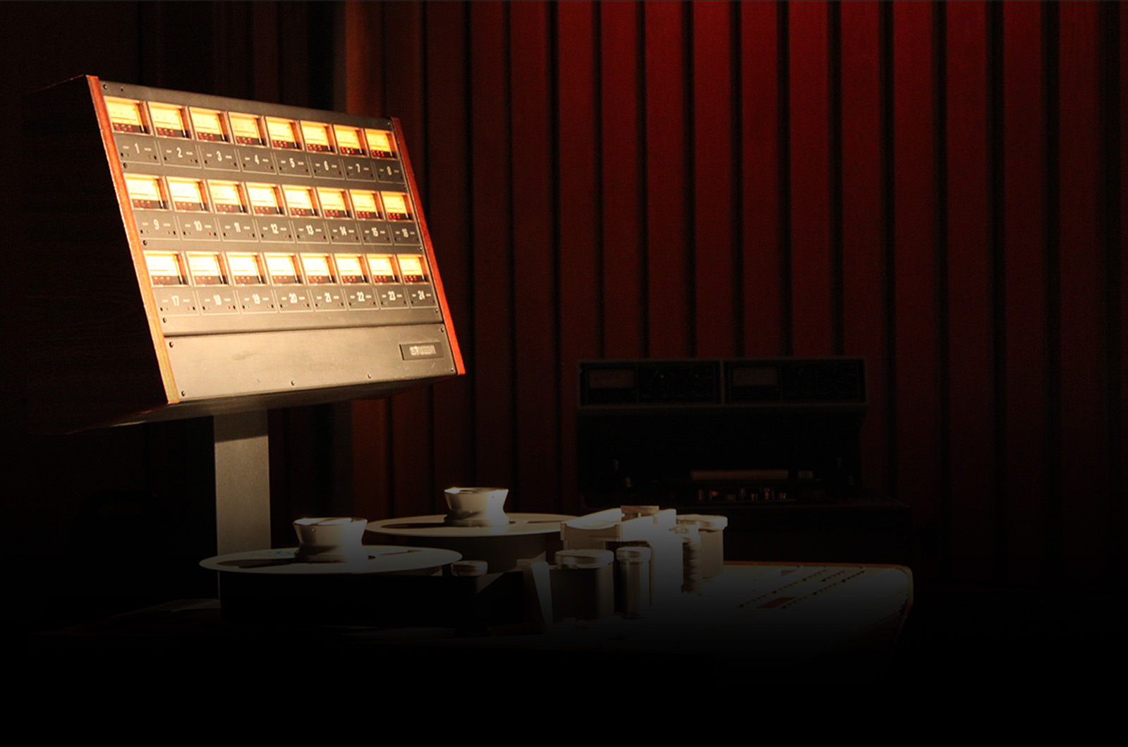 Vintage studio meter bridge and tape machine from UE's Reference Remastered launch page